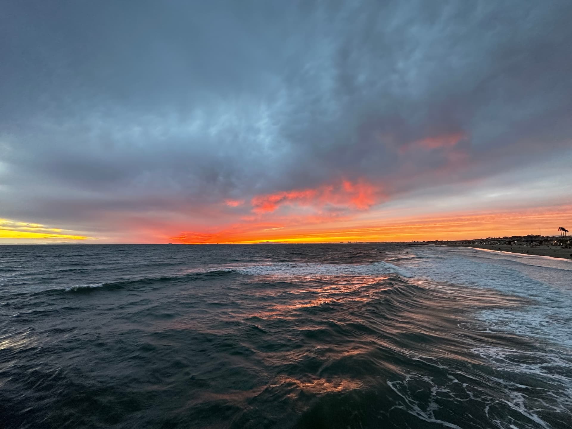 Sunset over the surf at Newport Beach